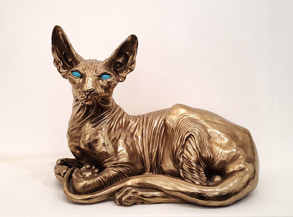 Andrzej Szymczyk: This stunning Bronze Sculpture by Andrzej Szymczyk represents a beautiful Spinx Cat. This particualr sculpture has turquoise eyes and is exhibited at Norton Way Gallery, Hertfordshire