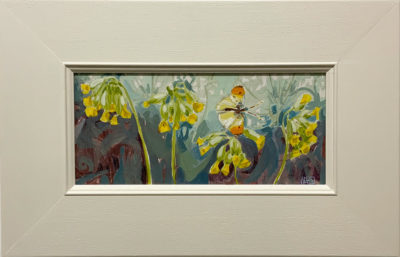 Orange-tip and Cowslips by Amie Haslen. Amie Haslen has Framed this acrylic painting in a simple and stylish off white wooden frame. It is exhibited at Norton Way Gallery.