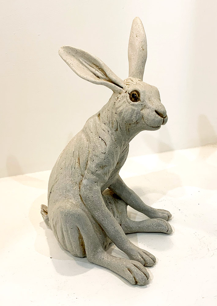 Alert white hare by Pippa Hill. This small white ceramic hare from Pippa Hill is exhibited at Norton Way Gallery Hertfordshire.