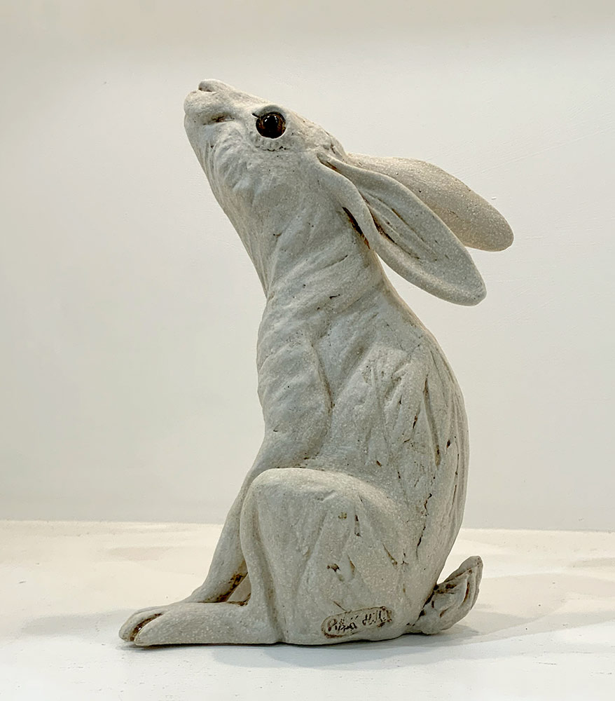Moongazing white hare by Pippa Hill. This small white ceramic hare from Pippa Hill is exhibited at Norton Way Gallery Hertfordshire.