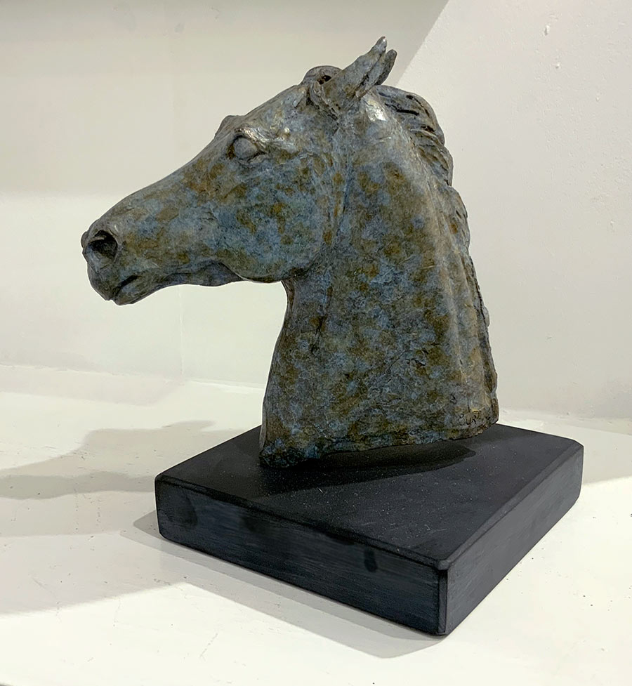 Bronze Sculpture by Debborah Burt. This beautiful small horse bust is cast in Foundry Bronze and displays all of the skills of a Deborah Burt bronze sculpture. It is exhibited at Norton Way Gallery Hertfordshire.