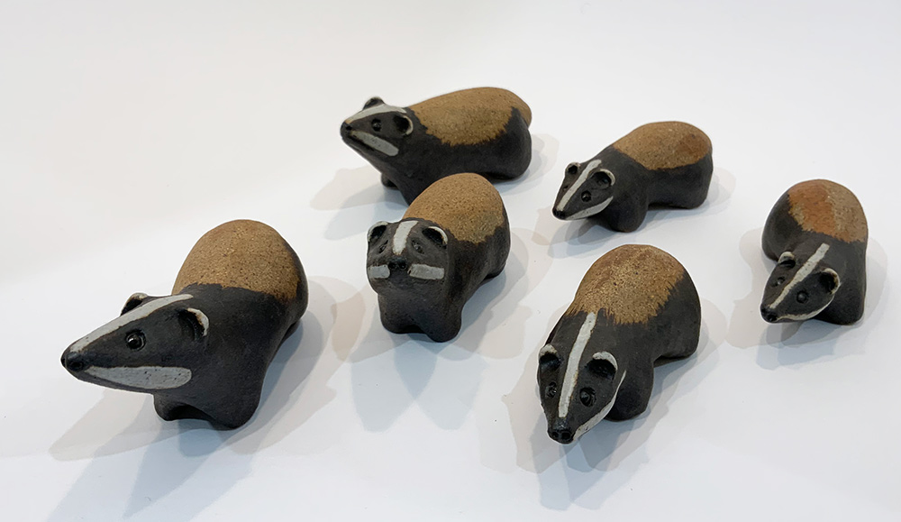 Simple, ceramic badgers by Pippa Hill. These ceramic badgers by Pippa Hill are delightful and cheery. They are exhibited at Norton Way Gallery Hertfordshire.