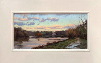 Original artwork by Rosemary Lewis. This original oil painting by Rosemary Lewis depicts a beautiful river scene, at dusk. It is exhibited at Norton Way Gallery Hertfordshire. Its framed in a simple, contemporary off white frame.