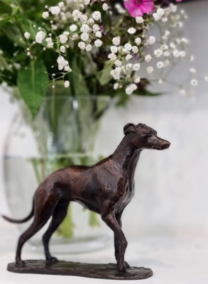 Foundry Bronze by Deborah Burt at Norton Way Gallery, Hertfordshire. Deborah Burt creats beautiful small to medium sized animal sculptures in foundry bronze. This depicts a pretty whippet.