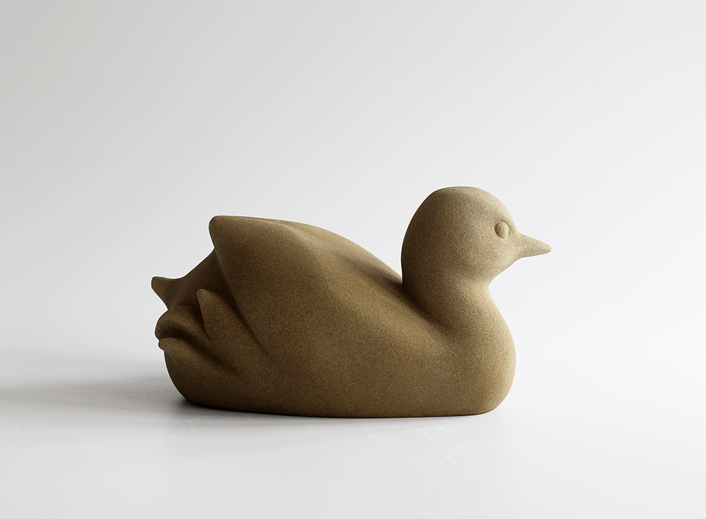 Jennifer Tetlow: This beautiful stone carving, sculpture by Jennifer Tetlow represents a lovely Dabchick. Each piece of Jennifer Tetlow sculpture is individually carverd from a pale York stone and exhibited at Norton Way Gallery Hertfordshire.