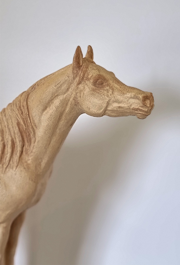 Susan Leyland at Norton Way Gallery. This fired clay sculpture is an original artwork by artist Susan Leyland. It depicts a beautiful Arab Horse with its tail aloft.