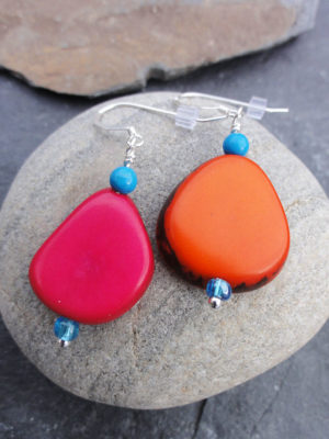 Sarh Cain Art Jewellery at Norton Way Gallery, Hertfordshire. These beautiful red and orange Tagua slice earrings are handmade by Sarah Cain.