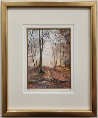 Rosalind Pierson art at Norton Way Gallery Hertfordshire. This beautiful, miniature, painting has been painted in watercolour. It is an original artwork from British artist Rosalind Pierson and depicts a shaded woodland scen in autumn. It is framed in a slim gold frame.