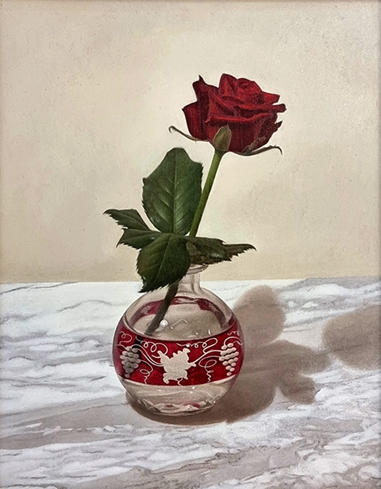 Sian Hopkinson at Norton Way Gallery, Hertfordshire. This original artwork by British artist, Sian Hopkinson is painted in oils. It depicts a red rose, in a small red and transparent glass vase, sat upon a top of marble. This original painting is framed in a dark black brown frame with a silver slip.