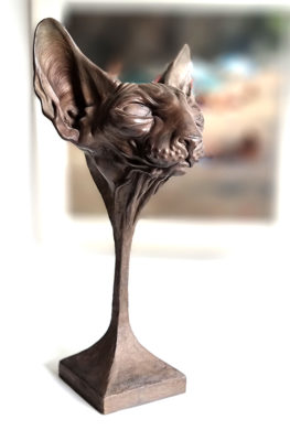 Andrzej Szymczyk sculpture at Norton Way Gallery Hertfordshire. This beautiful and unsual sculpture is created in foundry bronze by artist Andrzej Szymczyk. It depicts a powerful freestanding Spinx Cat Head on a pedestal in a dark bronze patina.