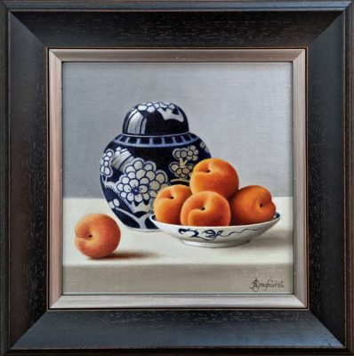 Anne Songhurst Art at Norton Way Gallery Hertfordshire. This beautiful oil painting is an original artwork by British artist Anne Songhurst. It is a still life painting, depicting five Apricots and a blue and white Ginger Jar. It is framed in a dark wood frame.