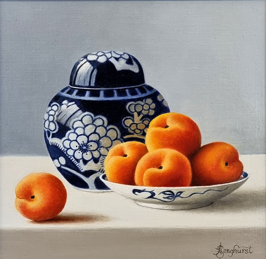 Anne Songhurst Art at Norton Way Gallery Hertfordshire. This beautiful oil painting is an original artwork by British artist Anne Songhurst. It is a still life painting, depicting five Apricots and a blue and white Ginger Jar. It is framed in a dark wood frame.
