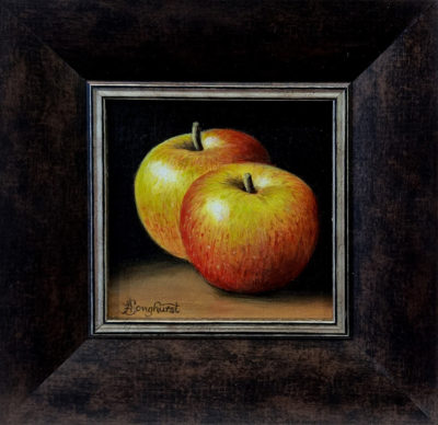 Anne Songhurst Art at Norton Way Gallery Hertfordshire. This beautiful oil painting is an original artwork by British artist Anne Songhurst. It is a still life painting, depicting two green and red Coxes apples. It is framed in a dark wood frame.