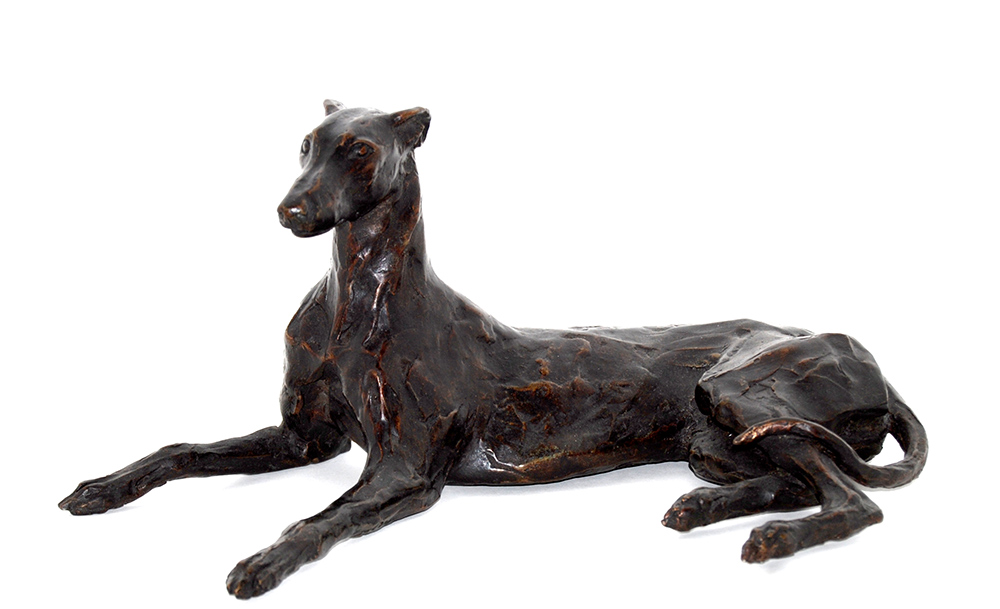 Stuart Anderson at Norton Way Gallery Hertfordshire. This beautiful foundry bronze sculpture from Stuart Anderson is an original artwork. It depicts a Greyhound alert and laying upright.