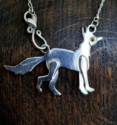 Lou Shotter at Norton Way Gallery, Hertfordshire. This original artwork by British artist, Lou Shotter is created in Stirling Silver. It is a pendant depicting a silver fox. A piece of jewellery.