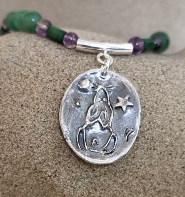 Sarah Cain at Norton Way Gallery, Hertfordshire. This original artwork by British artist, Sarah Cain is created in fine silver. It is a beautiful pendant, comprising fine silver with amethyst, Aventurine and Nephrite Jade. It depicts a star and moon gazing hare. A piece of jewellery.