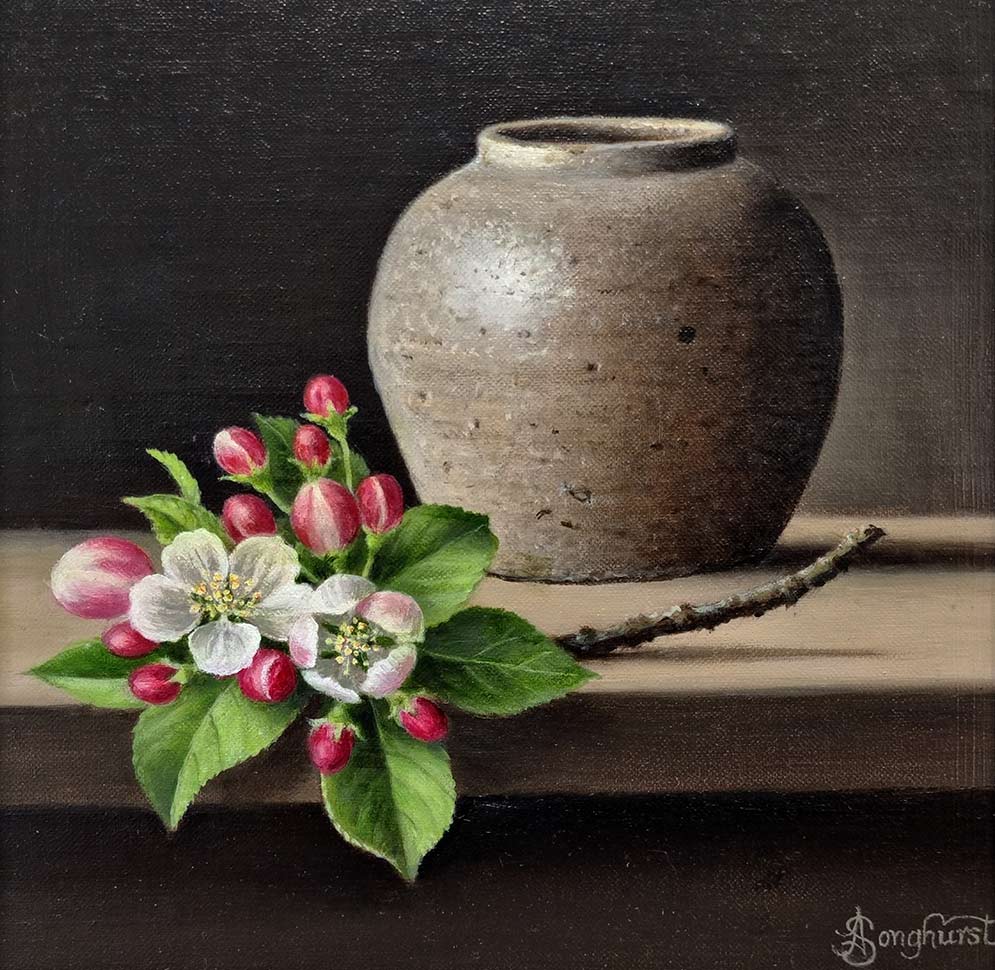 Anne Songhurst Art at Norton Way Gallery Hertfordshire. This beautiful oil painting is an original artwork by British artist Anne Songhurst. It is a still life painting, depicting a sprig of Apple Blossom and a Stoneware Jar. It is framed in a dark wood frame.
