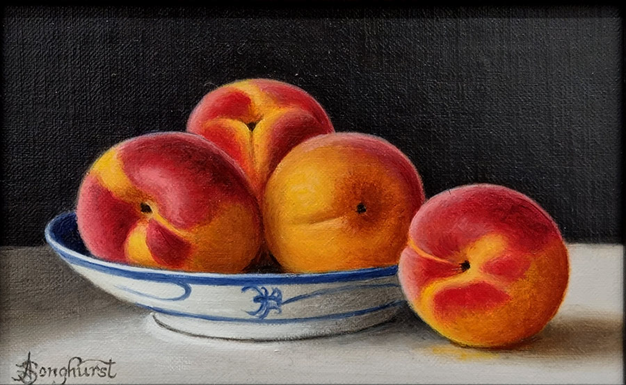 Anne Songhurst Art at Norton Way Gallery Hertfordshire. This beautiful oil painting is an original artwork by British artist Anne Songhurst. It is a still life painting, depicting four apricots. It is framed in a dark wood frame.