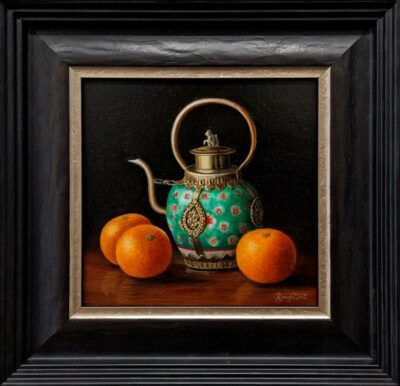 Anne Songhurst Art at Norton Way Gallery Hertfordshire. This beautiful oil painting is an original artwork by British artist Anne Songhurst. It is a still life painting, depicting three Satsumas and an ornate Tibetan Teapot. It is framed in a dark wood frame.