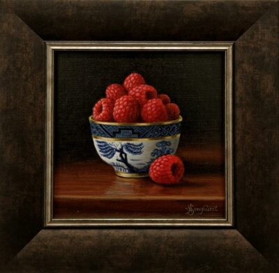 Anne Songhurst Art at Norton Way Gallery Hertfordshire. This beautiful oil painting is an original artwork by British artist Anne Songhurst. It is a still life painting, depicting a Willow Bowl and Raspberries. It is framed in a dark wood frame.