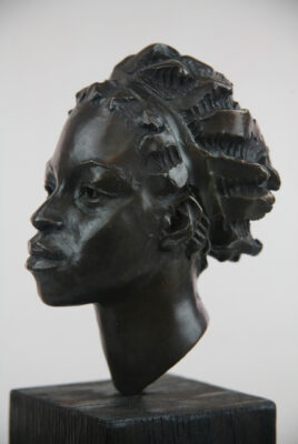 Andrzej Szymczyk bronze sculpture at Norton Way Gallery Hertfordshire. This beautiful African portrait, bronze sculpture is created in foundry bronze by artist Andrzej Szymczyk. It depicts a beautiful female headin a traditional bronze patina.