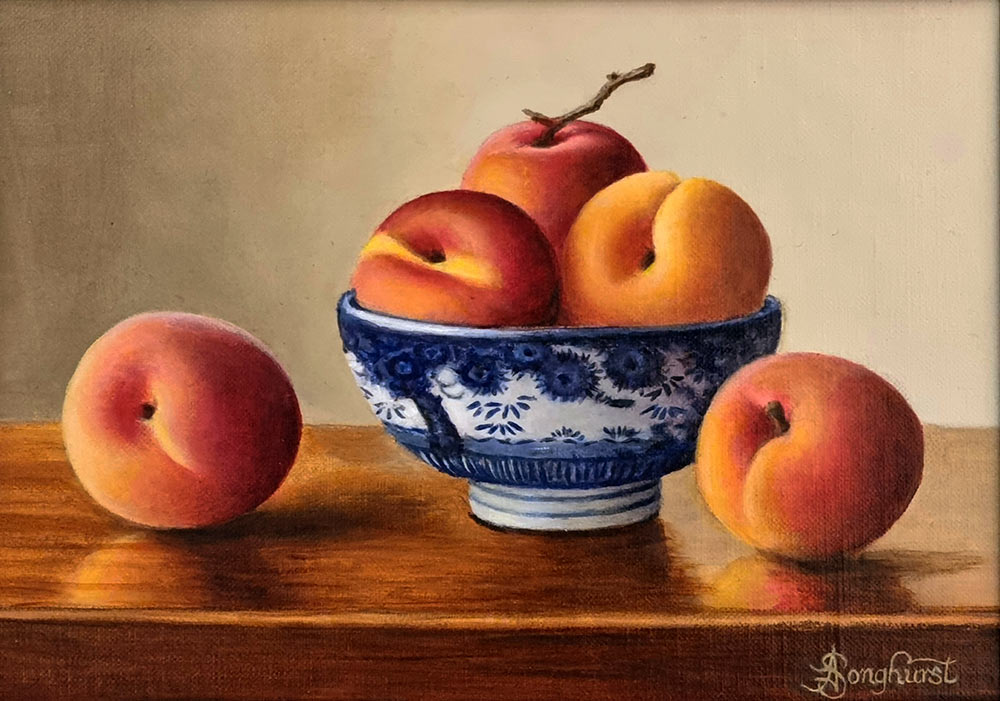 Anne Songhurst Art at Norton Way Gallery Hertfordshire. This beautiful oil painting is an original artwork by British artist Anne Songhurst. It is a still life painting, depicting several luscious apricots in a blue Japanese Bowl . This is accompanied by a pewter knife and jug. It is framed in a dark wood frame.