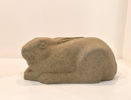 Jennifer Tetlow sculpture at Norton Way Gallery Hertfordshire. This beautiful stone carving, from Jennifer Tetlow is carved from Yourkstone. It depicts a symbolic, beautiful young hare, huddled down .