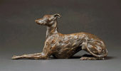 Stuart Anderson at Norton Way Gallery Hertfordshire. This beautiful foundry bronze sculpture from Stuart Anderson is an original artwork. It depicts the whippet alert and laying upright.